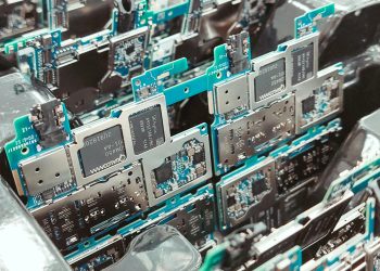 Close-up of intricate circuit boards in a Vietnamese factory, capturing modern electronics production.
