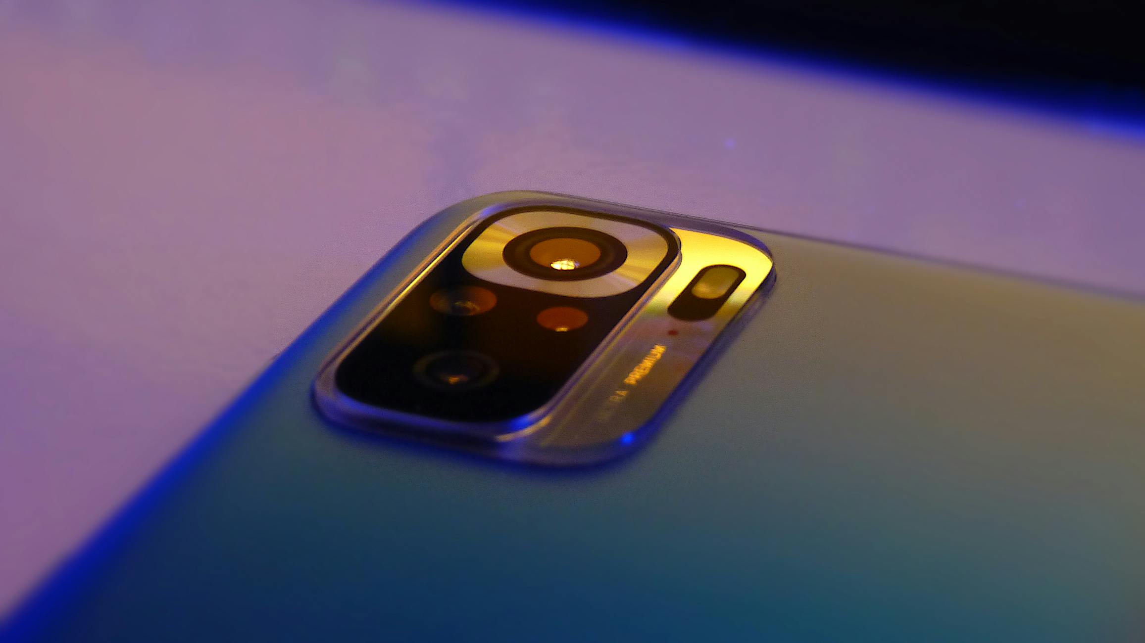 Macro shot of smartphone camera lens highlighting design and technology.