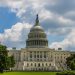 A stunning view of the iconic United States Capitol under a blue sky in Washington, D.C.