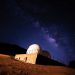 Stunning view of the Milky Way galaxy above a desert observatory under a starry night.