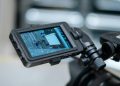Close-up view of a camera monitor displaying captured footage with detailed settings.