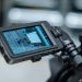 Close-up view of a camera monitor displaying captured footage with detailed settings.