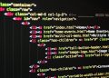 Close-up of vibrant HTML code displayed on a computer screen, showcasing web development and programming.