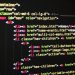 Close-up of vibrant HTML code displayed on a computer screen, showcasing web development and programming.