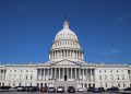 A striking image of the United States Capitol Building under a clear blue sky, symbolizing American democracy.