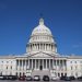 A striking image of the United States Capitol Building under a clear blue sky, symbolizing American democracy.