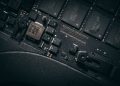 Detailed macro shot of electronic circuit board showing microchips and components.