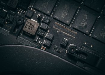 Detailed macro shot of electronic circuit board showing microchips and components.