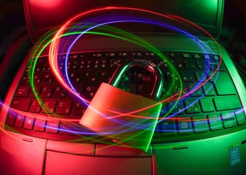 padlock on laptop with light trails