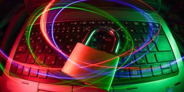 padlock on laptop with light trails