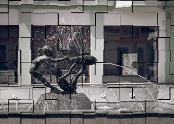 A modern fountain sculpture splashing water in an urban street, Brčko, Bosnia and Herzegovina.