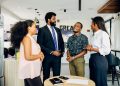 Group of professionals having a casual meeting in an office setting in Lagos.