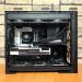 Detailed view of a custom-built gaming PC with visible components like graphics card and cooling system.