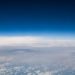 High-altitude view revealing the vastness of the sky with serene clouds.