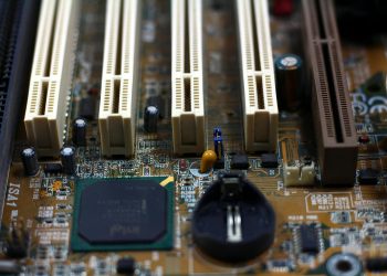 Detailed close-up of computer motherboard showing components like RAM slots and capacitors.