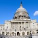 The United States Capitol Building in Washington, DC, with a clear blue sky.