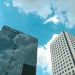 Low angle view of modern high-rise buildings and cloudy sky in Yangon, Myanmar.