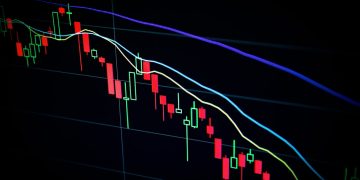 stock market candlestick chart on dark screen