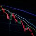 stock market candlestick chart on dark screen