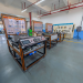 Spacious engineering laboratory equipped with advanced training systems and desks.