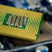 Detailed close-up of a microprocessor on a motherboard showcasing its intricate design.