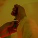 Close-up of a scientist handling a syringe and vial, highlighting laboratory work.