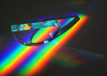 Vivid display of light spectrum through a prism, showcasing vibrant colors in an abstract artistic style.