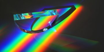 Vivid display of light spectrum through a prism, showcasing vibrant colors in an abstract artistic style.