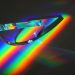 Vivid display of light spectrum through a prism, showcasing vibrant colors in an abstract artistic style.