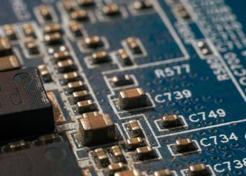 Detailed macro shot of a circuit board highlighting electronic components and traces.