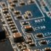 Detailed macro shot of a circuit board highlighting electronic components and traces.