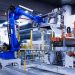 blue industrial robot arm in factory
