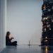 man in black jacket sitting on black chair