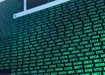 Vibrant green numbers on a computer screen, showcasing binary code and data streams.
