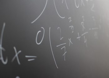 Blackboard with handwritten mathematical example for solve on lesson during studies in classroom of university