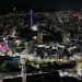 Stunning aerial night view of Busan city, highlighting Busan Tower in South Korea.