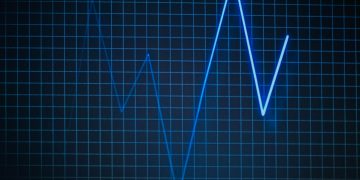 ECG graph on a grid background symbolizing heartbeat and medical data.