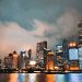 Captivating view of Shanghai's illuminated skyline reflecting on the Huangpu River at night.