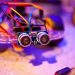 Detailed view of a robotic vehicle component showcasing wires and sensors.