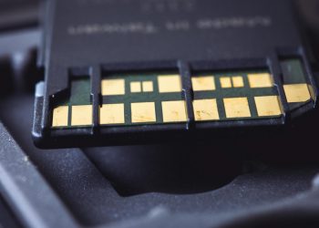 Detailed macro shot of SD card connector pins, highlighting technology and electronics.