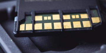 Detailed macro shot of SD card connector pins, highlighting technology and electronics.
