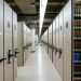 Spacious library archive with organized compact shelving and storage units.