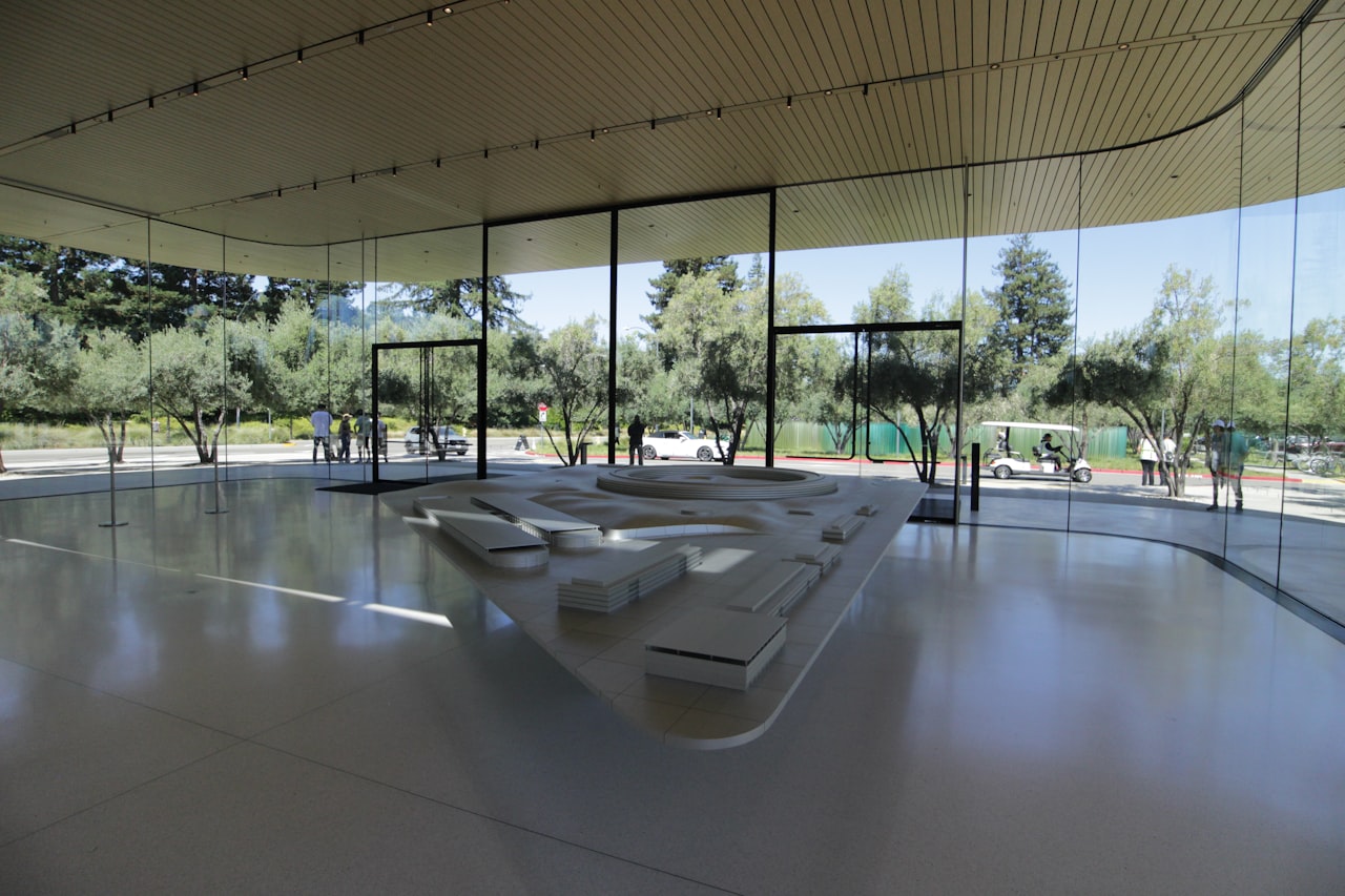 Modern architectural model displayed in a bright, airy space.