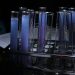 A vivid array of purple solutions in test tubes during a chemical experiment.