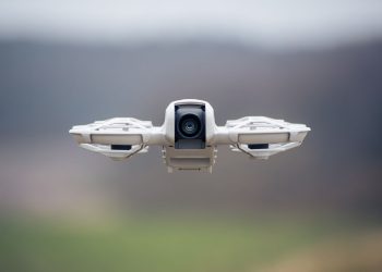 A high-resolution image of a drone flying outdoors, capturing technology's essence and innovation.