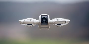 A high-resolution image of a drone flying outdoors, capturing technology's essence and innovation.