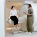 A patient consults with a technician in a modern MRI room, highlighting advanced healthcare facilities.