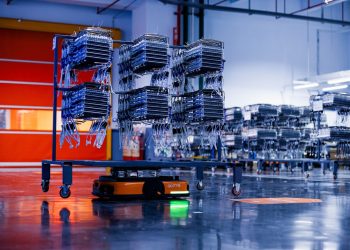 a large group of boxes sitting on top of a conveyor belt