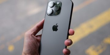 a person holding an iphone in their hand
