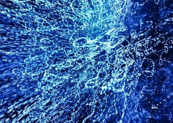 Vivid abstract image of dynamic blue light patterns creating a captivating visual effect.